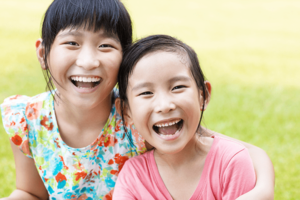 a couple of girls smiling