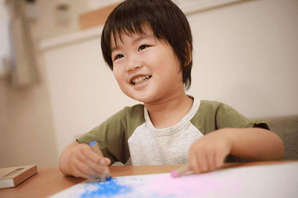 a child sitting at a table