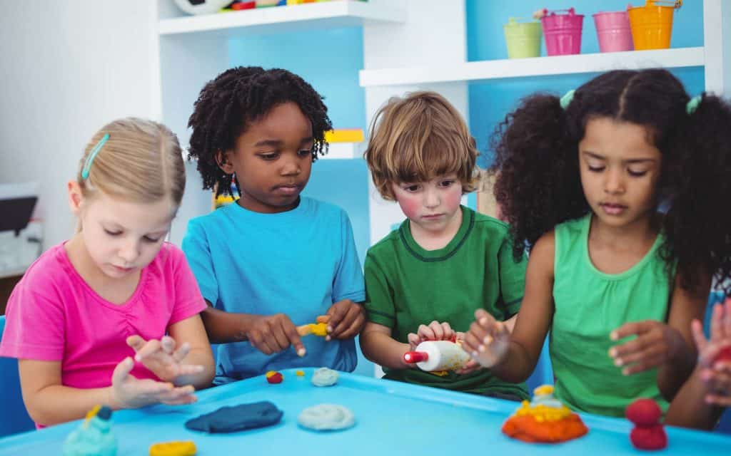 kids playing with modelling clay