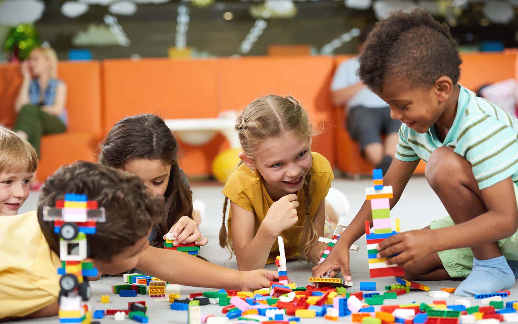 Cute kids playing together indoor. Preschool early education_