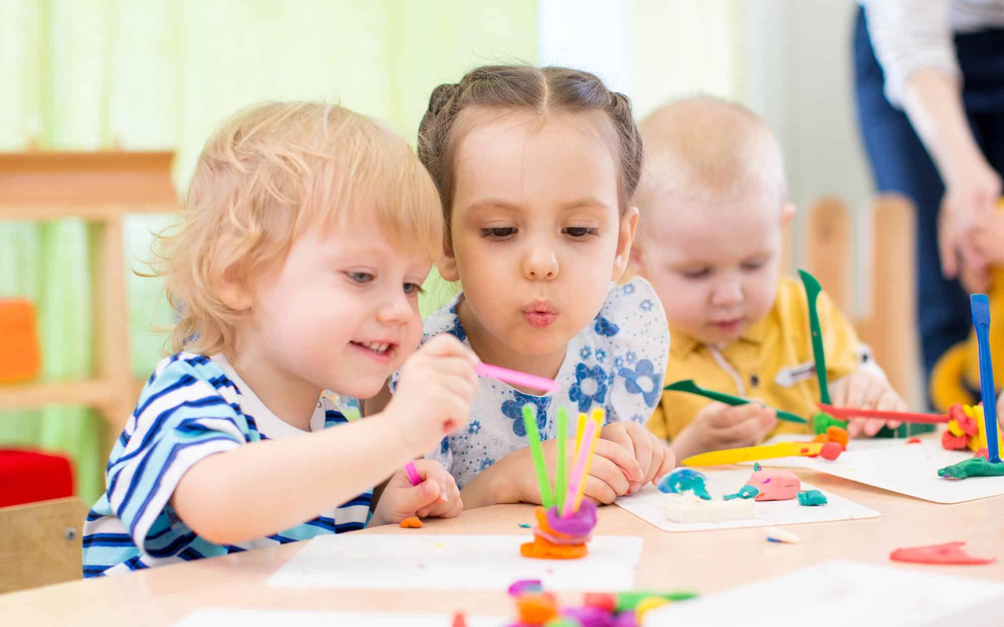 Side view of two children playing togehter