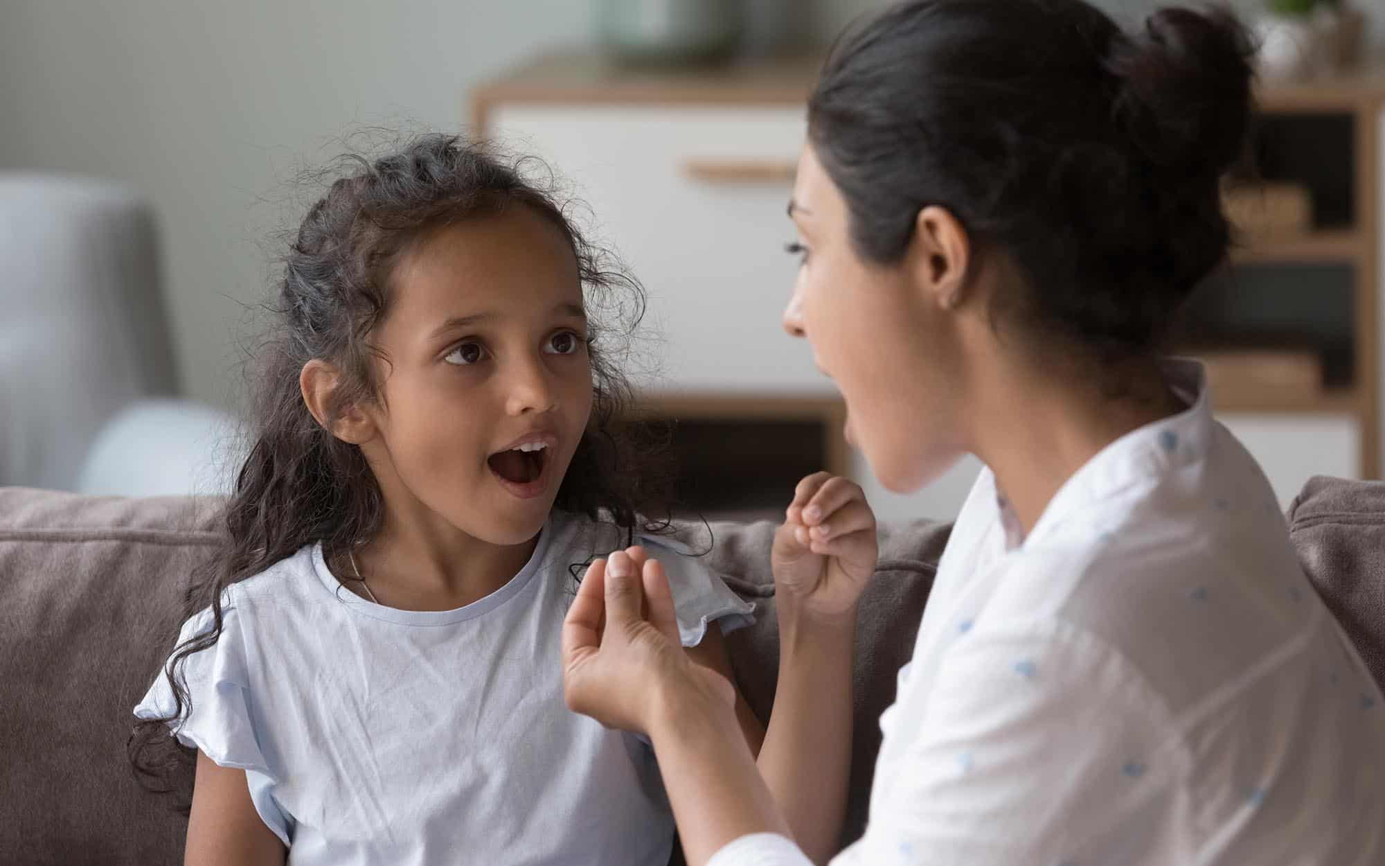 Side view of therapist with child patient